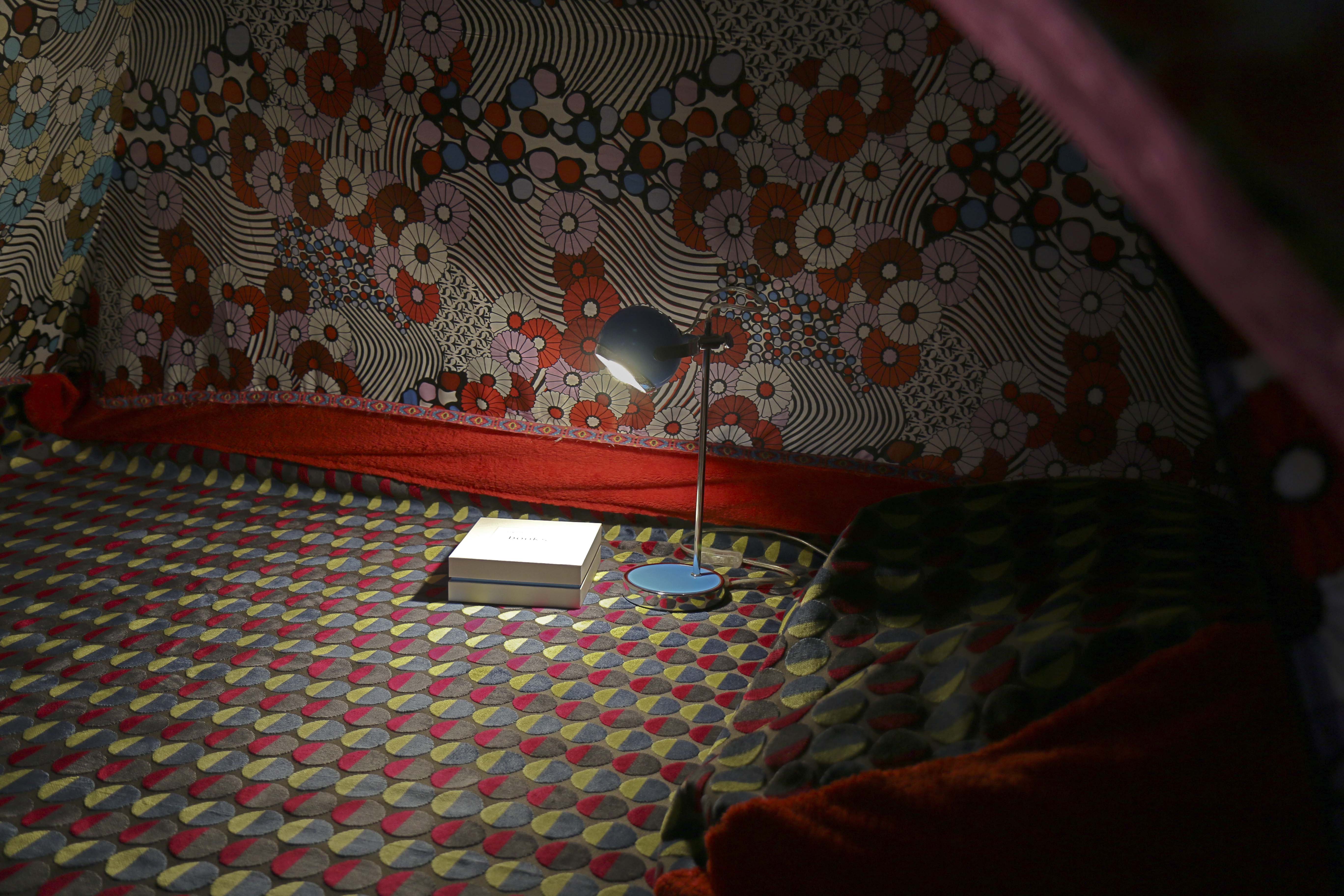 tent interior, book box and lamp